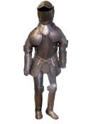 Replica suit of armour on display stand.