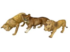 Two Coalport lions and West German lion (3).