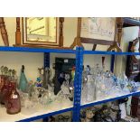 Good collection of clear and coloured glass including glass decanters, glass clowns, paperweights,