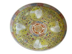 Chinese famille jaune plate with roundels of birds on foliate ground, 21cm diameter.