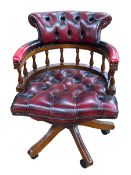 Ox blood buttoned leather Captains style swivel desk chair.