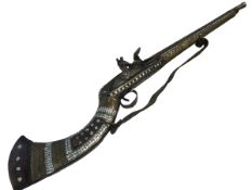 Replica inlaid mother of pearl flintlock rifle.