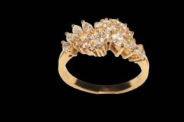 18 carat yellow gold claw set diamond cluster ring set with 16 round brilliant cut diamonds and