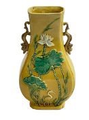 Chinese yellow glazed vase with relief foliage and bird decoration, 15.5cm.