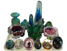 Collection of coloured glass including Mdina paperweights.