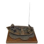 Composite fishermen sculpture on wooden plinth, 45cm long.