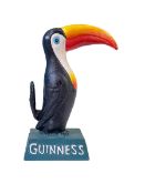 Cast metal toucan figure marked Guinness, 20cm high.