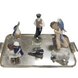 Six pieces of Royal Copenhagen including Faun with Parrot, Peasant Boy with Hammer,