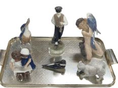 Six pieces of Royal Copenhagen including Faun with Parrot, Peasant Boy with Hammer,