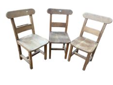 Set of three vintage oak chapel chairs.