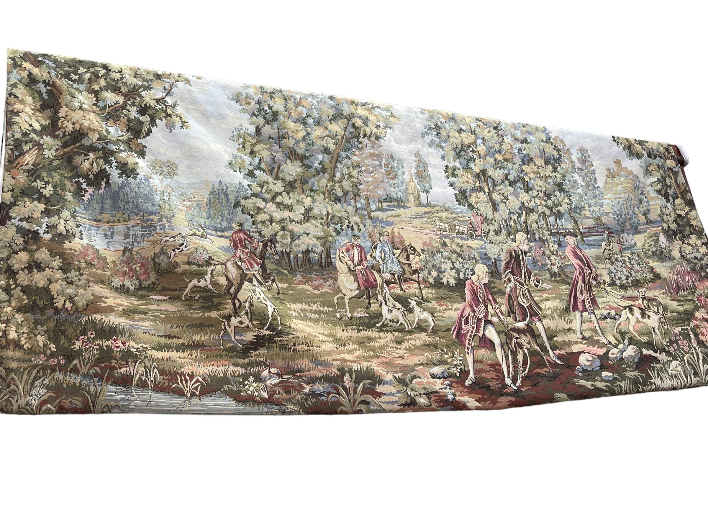 Tapestry wall hanging depicting landed gentry with horses and dogs, 130cm by 290cm,