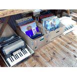 Verdi II Hohner and an Alvani accordion together with two boxes of LP records.