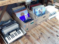 Verdi II Hohner and an Alvani accordion together with two boxes of LP records.