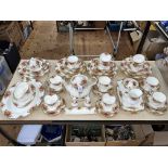 Over sixty pieces of Royal Albert Old Country Roses tea and dinnerware.