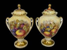 Pair Aynsley Orchard Gold lidded vases, signed D. Jones, 22cm.