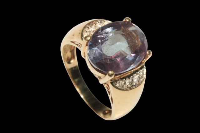 Large oval Alexandrite ring set with four small diamonds to each shoulder in 9 carat yellow gold, - Image 2 of 2