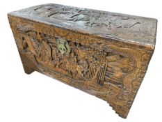 Oriental carved camphor wood trunk, 60cm by 104cm by 52cm.