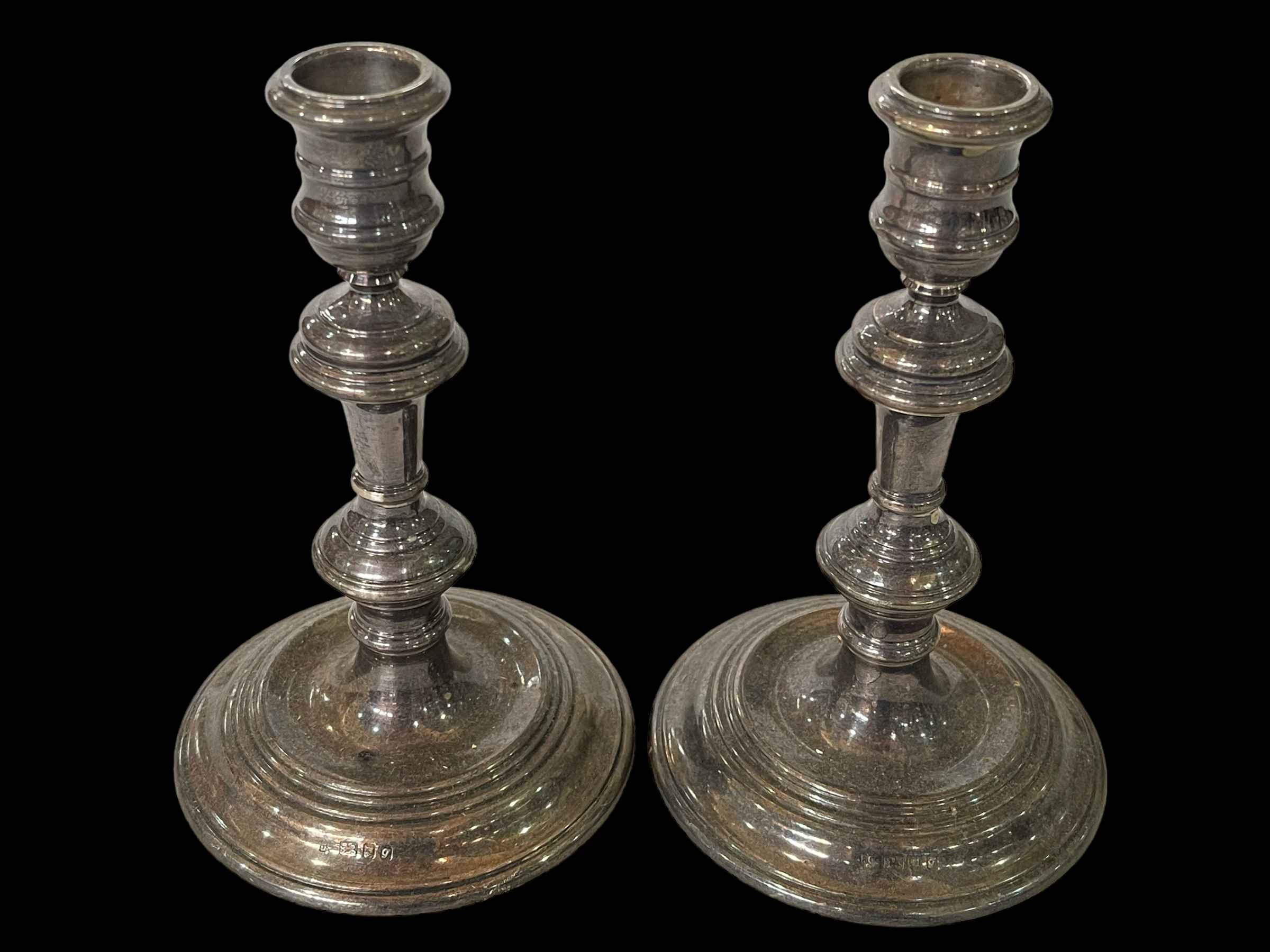 Pair silver loaded candlesticks, London 1962, 16cm.