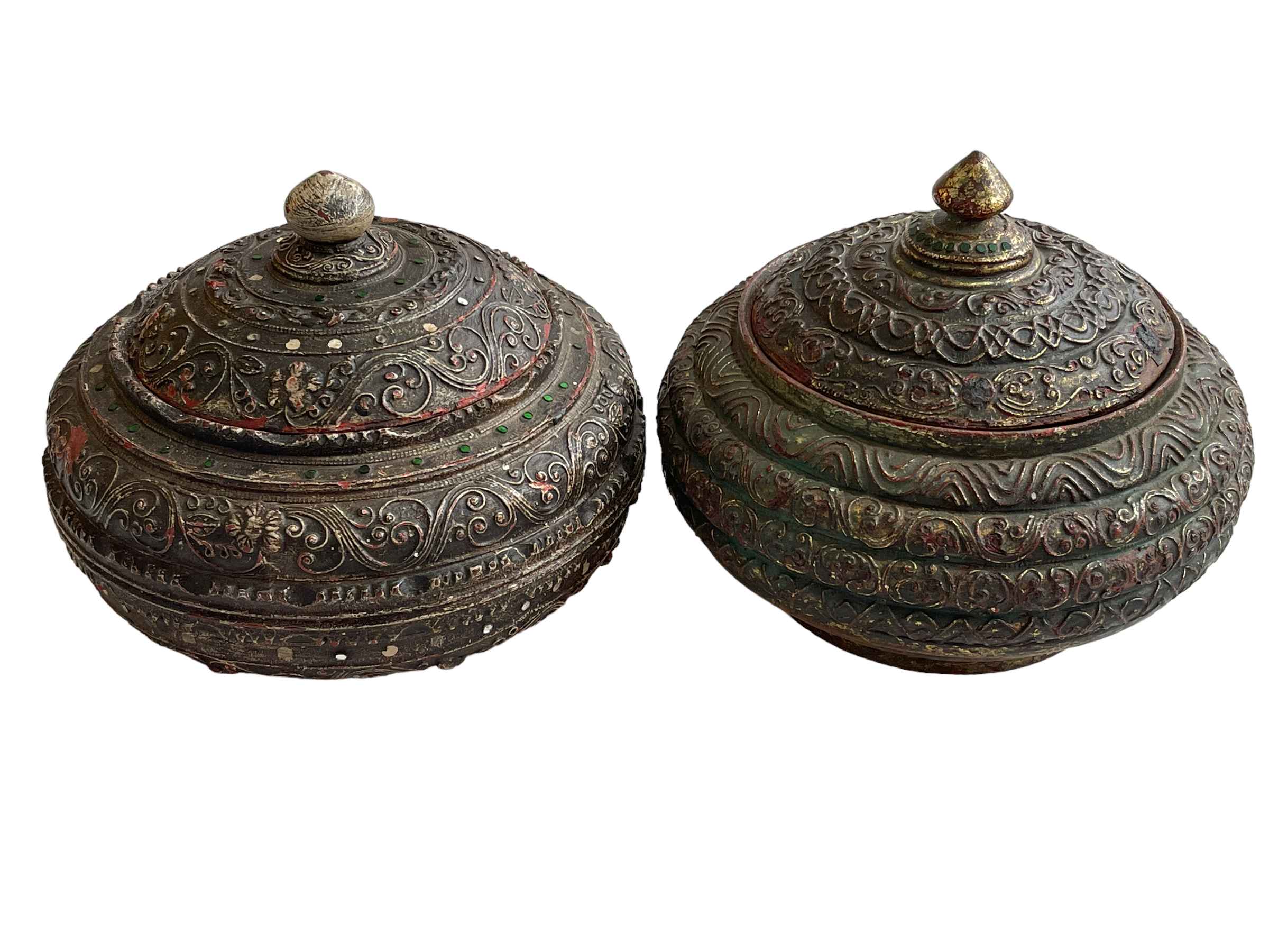 Two Asian heavily carved wood lidded bowls.