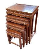 Quartetto nest of Oriental rosewood tables, largest 69cm by 50cm by 35.5cm.
