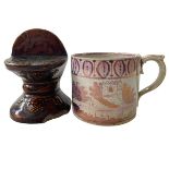 Victorian pink lustre mug, and brown glazed mask furniture stand (2).