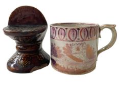 Victorian pink lustre mug, and brown glazed mask furniture stand (2).