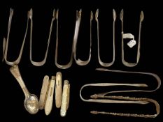 Collection of nine pairs of silver sugar tongs including four bright cut and one cast arm examples,