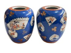 Pair of Chinese bulbous vases decorated with various scenes in fan shaped panels on blue ground,