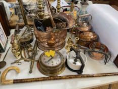 Beaten copper coal scuttle, ships clock, brass coloured table lamps, irons, etc.