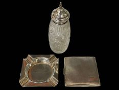 Silver engine-turned cigarette case, Birmingham 1934, silver ashtray, and silver topped caster (3).