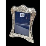 Silver easel photograph frame with embossed decoration, London modern, 23cm by 18cm.