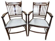 Pair Edwardian inlaid mahogany open armchairs.