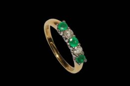 Emerald and diamond five stone 18 carat gold ring, size O.