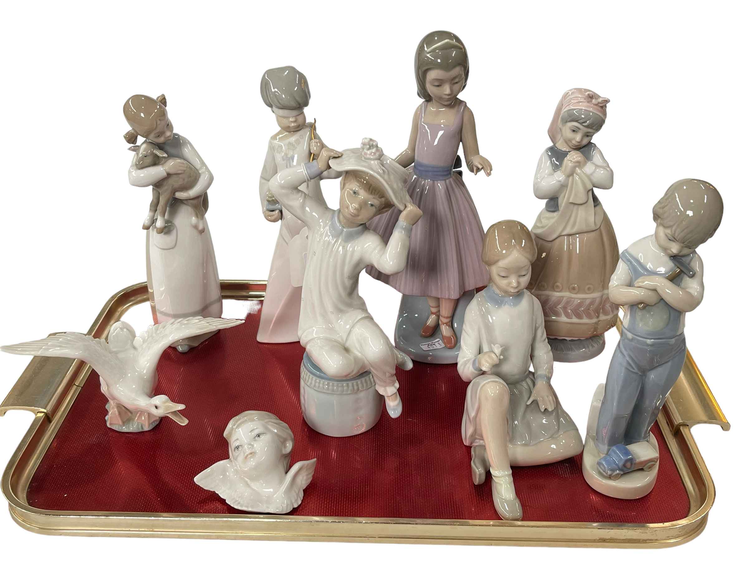 Collection of Lladro including seven figures, winged bust and goose.