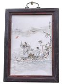 Small Chinese porcelain panel in wood frame decorated with figures in naturalistic wood boat,