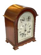 Mahogany arch top mantel clock.