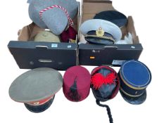 Two boxes of assorted hats.