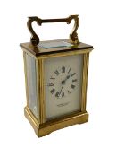 Gilt brass carriage clock, the face signed Garrard & Co Ltd, Regents Street.