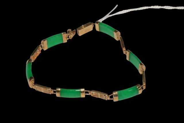 9 carat gold and green jade/stone bracelet.