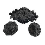 Two Whitby jet brooches and large replica brooch (3).