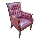 Burgundy deep buttoned and studded leather library chair.