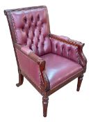 Burgundy deep buttoned and studded leather library chair.