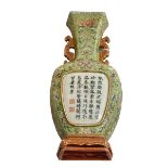 Chinese pottery wall vase decorated with floral design and verse, 21cm high.