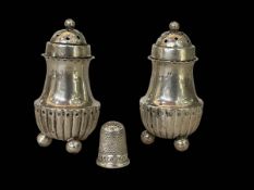 Pair of Hilliard & Thomason silver pepperettes and thimble.