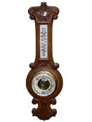 Carved oak barometer-thermometer, 58cm.