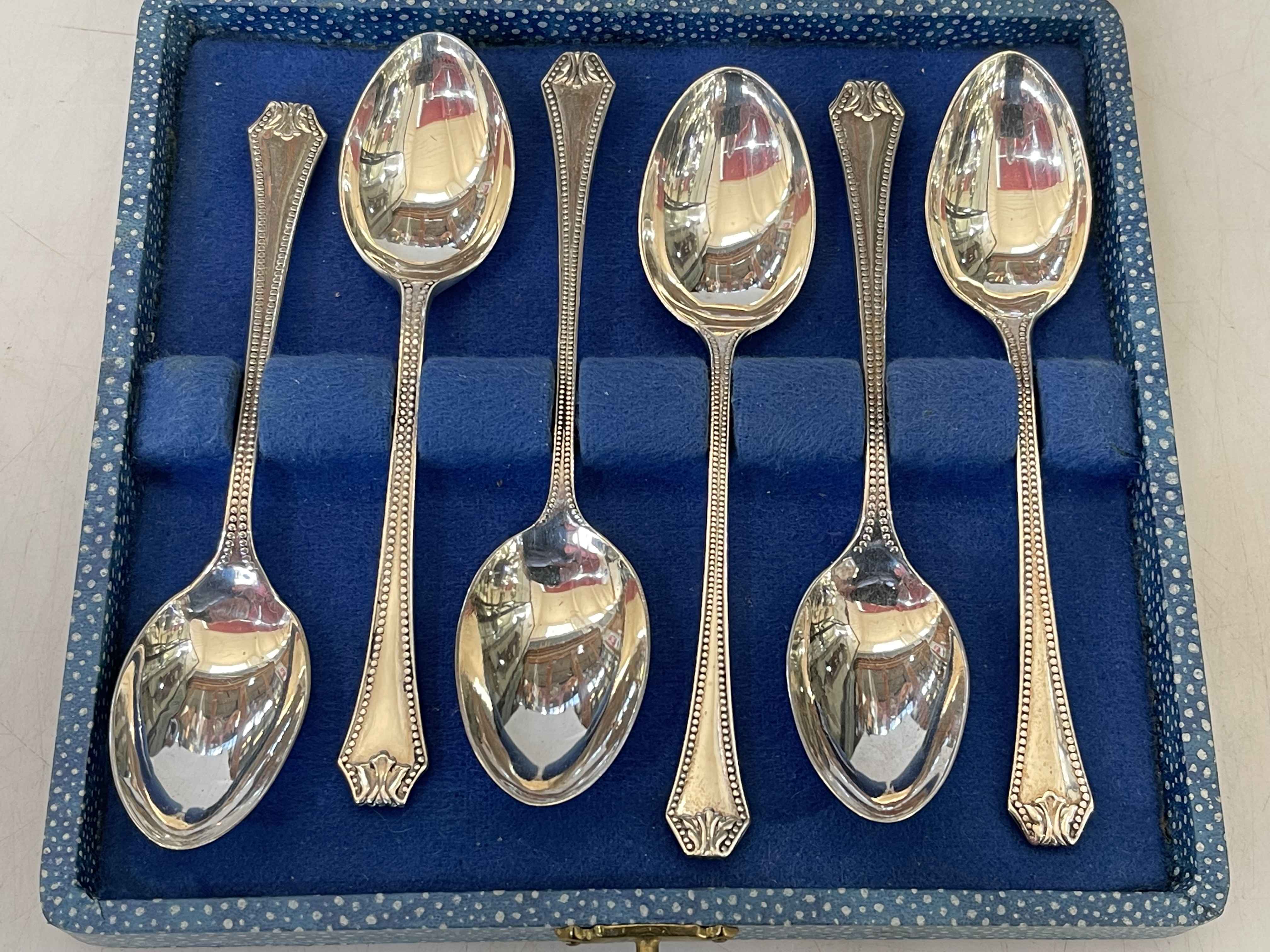 Set of six silver teaspoons with bead borders, Birmingham 1935.