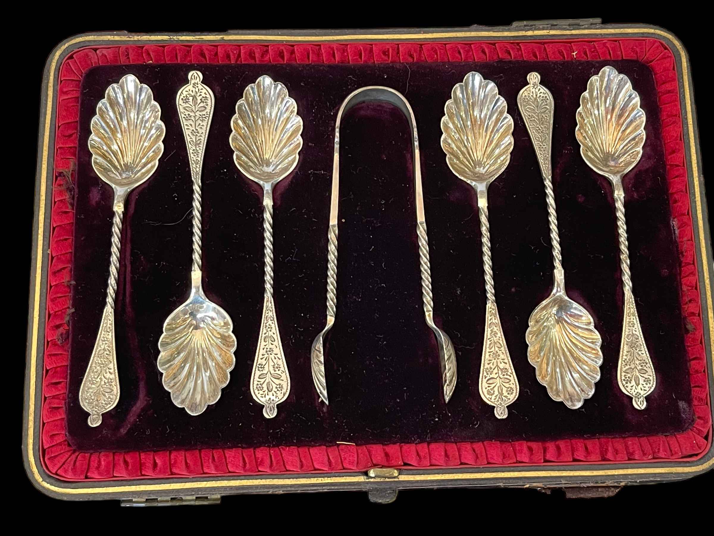 Hilliard & Thomason silver set of ornate shell bowl teaspoons and tongs, cased, Birmingham 1888.