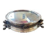 Impressive silver plated and mirror topped cakestand raised on lion mask and paw feet.