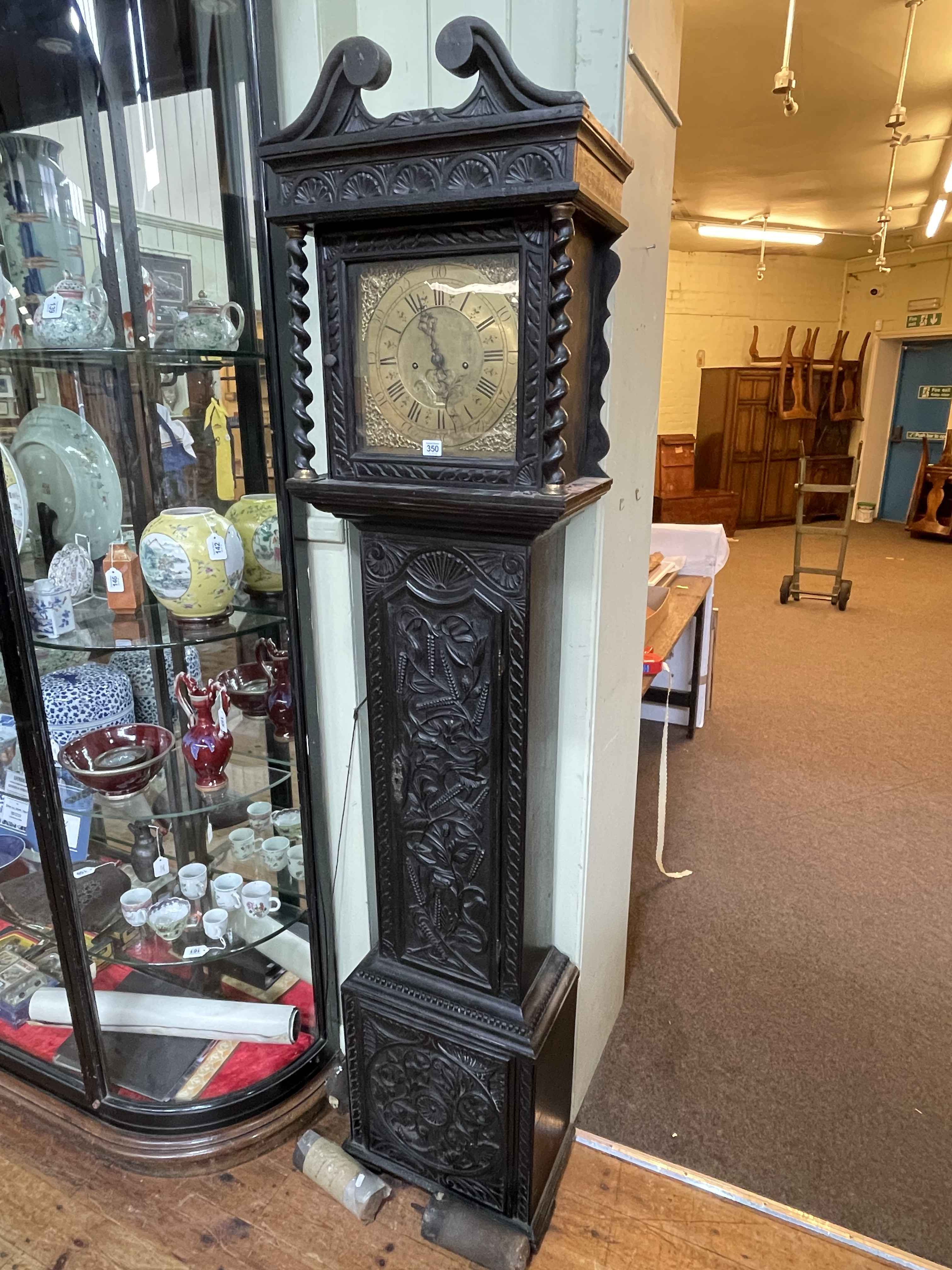 Antique carved oak cased eight day longcase clock, having square brass dial, signed Joseph Hallyfax,