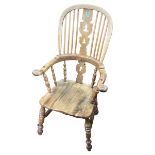 Windsor pierced splat back elbow chair.